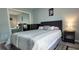Bedroom with a large bed, and view of closet with sliding doors at 2729 Club Cortile Cir, Kissimmee, FL 34746