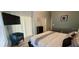 A primary bedroom features sliding glass doors, modern furnishings, and ample space at 2729 Club Cortile Cir, Kissimmee, FL 34746