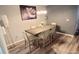 Spacious dining area features modern light fixture and vinyl floors at 2729 Club Cortile Cir, Kissimmee, FL 34746