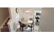 Dining area view boasts modern lighting and staircase access at 2729 Club Cortile Cir, Kissimmee, FL 34746