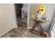 Inviting foyer boasts wood-look floors, stylish console table, and staircase at 2729 Club Cortile Cir, Kissimmee, FL 34746