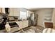 Modern kitchen features white cabinets, stainless steel appliances, and granite countertops at 2729 Club Cortile Cir, Kissimmee, FL 34746