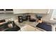 Close-up of kitchen counter with granite countertops and stainless appliances at 2729 Club Cortile Cir, Kissimmee, FL 34746