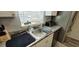 Stainless steel kitchen sink with granite countertops and natural light at 2729 Club Cortile Cir, Kissimmee, FL 34746
