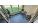 Relaxing screened-in patio features outdoor seating and views of lush greenery at 2729 Club Cortile Cir, Kissimmee, FL 34746