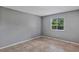 Bedroom with tile flooring and a window offering natural light at 2864 N Powers Dr # 150, Orlando, FL 32818