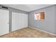 Bedroom featuring closet doors, a window and tiled floor at 2864 N Powers Dr # 150, Orlando, FL 32818