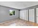 Bedroom with tile floor, closet with bifold doors and a window with natural light at 2864 N Powers Dr # 150, Orlando, FL 32818
