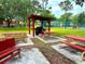 Inviting community area featuring picnic tables, a grill, and a shaded pavilion for outdoor gatherings at 2864 N Powers Dr # 150, Orlando, FL 32818