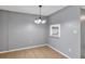Cozy dining area featuring modern chandelier and connecting pass-through to the kitchen at 2864 N Powers Dr # 150, Orlando, FL 32818