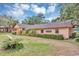 Office/Clubhouse building with neatly manicured lawn and flower beds at 2864 N Powers Dr # 150, Orlando, FL 32818