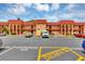Condo complex exterior with well-defined parking spaces and pedestrian access to each unit at 2864 N Powers Dr # 150, Orlando, FL 32818