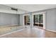 Expansive living room offers a mirrored wall and access to the screened porch at 2864 N Powers Dr # 150, Orlando, FL 32818