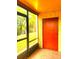 Enclosed patio with view of a lawn through the screen and stucco wall at 2864 N Powers Dr # 150, Orlando, FL 32818