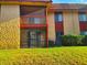 Screened patio with terracotta tile and stucco exterior, ideal for enjoying outdoor living in comfort at 2864 N Powers Dr # 150, Orlando, FL 32818