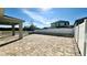 Spacious backyard with paver patio, white fence, and a covered patio at 2922 Crest Dr, Kissimmee, FL 34744