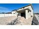 Wide open patio with a covered patio, white fence, and an adjacent house at 2922 Crest Dr, Kissimmee, FL 34744