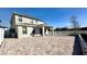 Large open backyard with a stone paver patio and a covered patio at 2922 Crest Dr, Kissimmee, FL 34744