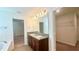 Elegant bathroom with double sinks, granite countertops, and stylish lighting fixtures at 2922 Crest Dr, Kissimmee, FL 34744