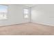 A well-lit bedroom with carpet flooring, two windows, and neutral walls provides a cozy atmosphere at 2922 Crest Dr, Kissimmee, FL 34744