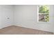 Bright and airy bedroom with double closet and ample natural light streaming through the window at 2922 Crest Dr, Kissimmee, FL 34744