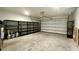 Spacious garage featuring ample storage shelving and an automatic door, offering convenient parking at 2922 Crest Dr, Kissimmee, FL 34744