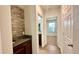 Hallway featuring a stone accent wall and granite countertop at 2922 Crest Dr, Kissimmee, FL 34744