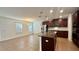 Open kitchen featuring stainless steel appliances, granite countertops, and a breakfast bar at 2922 Crest Dr, Kissimmee, FL 34744