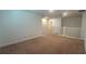 Spacious upstairs landing with carpet and view of stairs and hallway at 2922 Crest Dr, Kissimmee, FL 34744