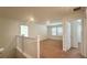 Open loft area upstairs with neutral carpeting and ample natural light at 2922 Crest Dr, Kissimmee, FL 34744