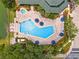 Overhead shot of a sparkling pool with ample lounge seating for relaxing by the water at 3060 Pirates Retreat Ct # 309, Kissimmee, FL 34747