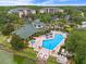Community pool area surrounded by lush landscaping offers a refreshing retreat for residents at 3060 Pirates Retreat Ct # 309, Kissimmee, FL 34747