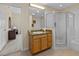 Updated bathroom features a glass shower, tub and light wood cabinets at 3060 Pirates Retreat Ct # 309, Kissimmee, FL 34747