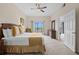 Bedroom has queen size bed, balcony, and a wicker chest of drawers at 3060 Pirates Retreat Ct # 309, Kissimmee, FL 34747