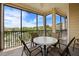 Cozy patio featuring a table and seating for outdoor relaxation with scenic views at 3060 Pirates Retreat Ct # 309, Kissimmee, FL 34747