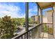 This patio overlooks a lush green space with parking and a view of the building at 3060 Pirates Retreat Ct # 309, Kissimmee, FL 34747