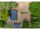 Aerial view of a house and its surroundings, showcasing its backyard and proximity to neighboring properties at 308 Forest St, Fruitland Park, FL 34731