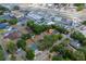 Aerial view of the property nestled among commercial and residential areas at 308 Forest St, Fruitland Park, FL 34731