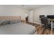 Bedroom with brick walls, a bed, desk, and wood floors at 308 Forest St, Fruitland Park, FL 34731
