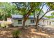 Lovely single-story house surrounded by beautiful trees at 308 Forest St, Fruitland Park, FL 34731