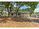 Cozy single-story home with mature trees, offering shade and curb appeal at 308 Forest St, Fruitland Park, FL 34731