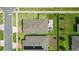 Aerial view of a home featuring a backyard patio, a pergola, and lush green grass at 3443 Florigold Grove St, Clermont, FL 34711