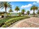 Waterbrooke community entrance featuring lush landscaping and brick-paved roads and sidewalks at 3443 Florigold Grove St, Clermont, FL 34711