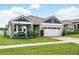 Beautiful single-Gathering home boasting a spacious two-car garage, and professional landscaping at 3443 Florigold Grove St, Clermont, FL 34711