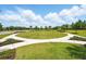 Community green space offers residents a beautiful place to relax and enjoy the outdoors at 3443 Florigold Grove St, Clermont, FL 34711
