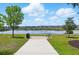 Community park featuring a scenic view of a lake at 3443 Florigold Grove St, Clermont, FL 34711