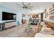 Open living space featuring contemporary decor, seamless flow to the dining area and a modern layout at 3443 Florigold Grove St, Clermont, FL 34711