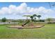 A safe community playground on a manicured lawn at 3443 Florigold Grove St, Clermont, FL 34711