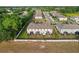 Aerial view of the backs of townhomes with screened-in patios in a well-maintained community at 352 Smugglers Way, Apopka, FL 32712