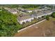Aerial view of the backs of townhomes with screened-in patios in a well-maintained community at 352 Smugglers Way, Apopka, FL 32712